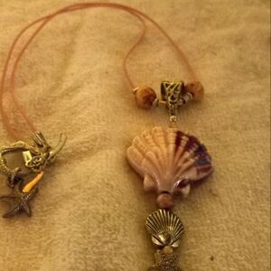 Narrow pink cording pink ceramic shell  18in necklace